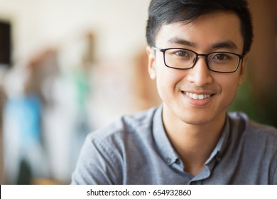 Closeup Portrait Of Smiling Young Asian Man