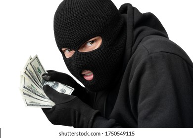 Closeup Portrait Of Sneaky Burglar With Black Mask And Gloves Counting Money And Looking At Camera, Isolated On White