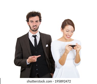 Closeup Portrait Sneaky Upset Jealous Possessive Boyfriend Angry Watching Girlfriend Happily Texting Someone Else Isolated White Background. Negative Emotion Facial Expression Feeling Conflict Concept