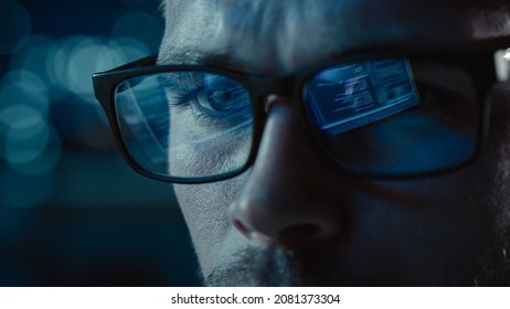 Close-up Portrait of Software Engineer Working on Computer, Line of Code Reflecting in Glasses. Developer Working on Innovative e-Commerce Application using Machine Learning, AI Algorithm, Big Data