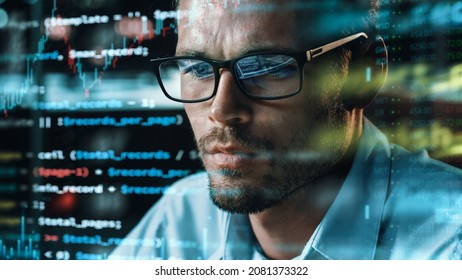 Close-up Portrait Of Software Engineer Working On Computer, Line Of Code Run Aroung Him. Developer Working On Innovative E-Commerce Application Using Big Data Concept