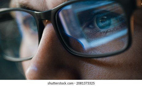 Close-up Portrait of Software Engineer Working on Computer, Line of Code Reflecting in Glasses. Developer Working on Innovative e-Commerce Application using Machine Learning, AI Algorithm, Big Data - Shutterstock ID 2081373325