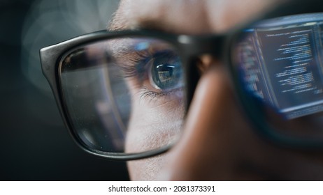 Close-up Portrait of Software Engineer Working on Computer, Line of Code Reflecting in Glasses. Developer Working on Innovative e-Commerce Application using Machine Learning, AI Algorithm, Big Data - Shutterstock ID 2081373391