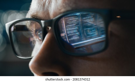 Close-up Portrait of Software Engineer Working on Computer, Line of Code Reflecting in Glasses. Developer Working on Innovative e-Commerce Application using Big Data Concept