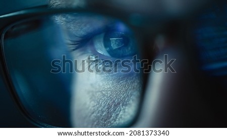 Close-up Portrait of Software Engineer Working on Computer, Line of Code Reflecting in Glasses. Developer Working on Innovative e-Commerce Application using Big Data AI. Stylish Macro Shot of Eye