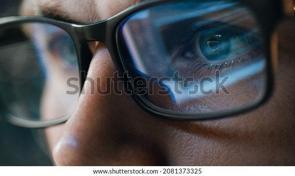 Close-up Portrait of Software Engineer Working on\
Computer, Line of Code Reflecting in Glasses. Developer Working on\
Innovative e-Commerce Application using Machine Learning, AI\
Algorithm, Big Data