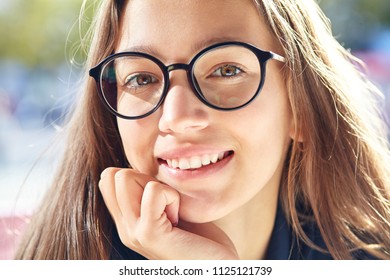closeup portrait of a stylish teenage girl in glasses - Shutterstock ID 1125121739
