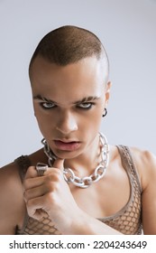 Close-up Portrait Of Stylish Young Man With Makeup Posing Isolated Over Grey Studio Background. Male Expression. Concept Of Fashion, Freedom Of Choice, Lifestyle, Lgbt, Generation Z, Trends