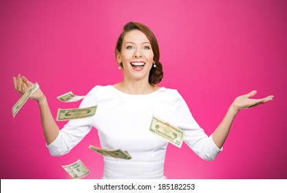 Closeup portrait super excited, laughing young woman who just won lots of money, trying to catch, throw dollar bills in air, isolated magenta background. Positive emotion, facial expression, feelings