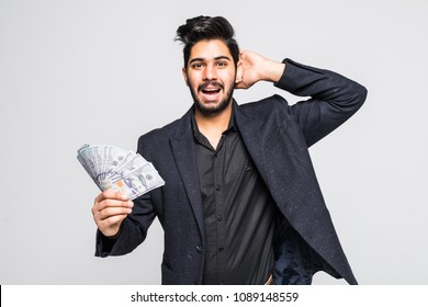 Closeup Portrait Of Super Happy Excited Successful Young Man Holding Money Dollar Bills In Hand, Isolated On White Background.