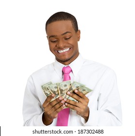 Closeup portrait super happy, excited, successful young man holding money dollar bills in hand isolated white background. Positive emotion, facial expression feeling reaction. Financial reward savings
