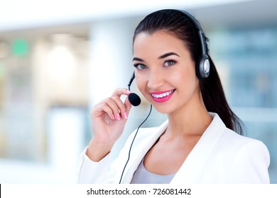 Closeup Portrait Of Support Phone Operator In Headset At Workplace