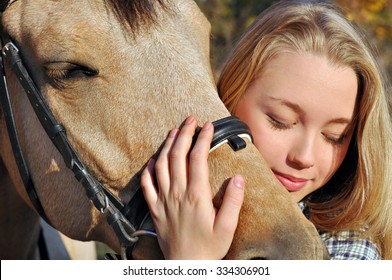 Close-up Portrait Of Teenage Girl And Horse 