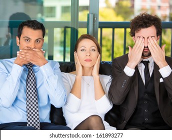 Closeup Portrait Of Three Business People On Black Couch Imitating See No Evil, Hear No Evil, Speak No Evil Concept, Isolated On City Urban Background. Human Emotions, Expressions And Communication