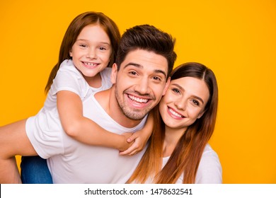 Close-up portrait of three nice attractive lovely cheerful cheery tender sweet person having fun spending weekend holiday daydream isolated over bright vivid shine yellow background - Powered by Shutterstock