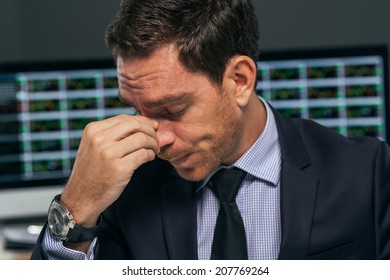 Close-up Portrait Of Tired Stock Market Trader