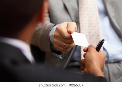 Closeup Portrait Of Two Successful Business Executive Exchanging Business Card