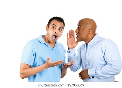 A Closeup Portrait Of Two Young Men, One Whispering To Another A Secret, Who Is Shocked, And Very Surprised, With Wide Opened Mouth, Isolated On White Background. Human Emotions And Facial Expressions