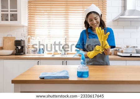 Close-up of the Portrait Two young professional housewives cleaning the house