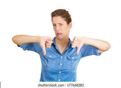 Closeup Portrait Of Unhappy, Angry, Mad, Pissed Off Woman, Annoyed Wife, Giving Thumb Down Gesture Looking With Negative Facial Expression, Disapproval, Isolated On White Background. Human Emotions