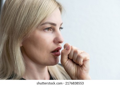 Closeup Portrait Of Unhealthy Young European Blonde Woman Coughing A Lot, Suffering With Cough, Has A Chest Pain. Sick Desperate Female Has Flu. Cold, Sickness, Bronchitis Concept. Fit Of Coughing