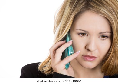 Close-up Portrait Of An Upset, Sad, Depressed And Worried Blonde Woman Talking On The Phone, Isolated On A White Background 