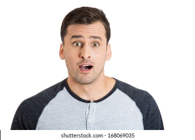 Closeup Portrait Of Wild, Goofy, Crazy, Funny, Shocked Surprised Stunned Young Man Face With Eyes Wide Open Mouth, Isolated On White Background. Positive Human Emotion Facial Expression