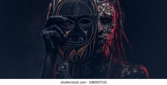 Close-up portrait of a witch from the indigenous African tribe, wearing traditional costume. Make-up concept. - Shutterstock ID 1080507155