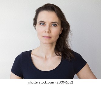 Close-up Portrait Of Woman 30-40 Years Old Looking Into Camera