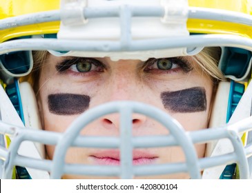 Closeup portrait of woman in american football helmet