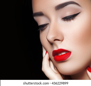 Close-up portrait of woman with beautiful face - isolated on black. Skin care concept.