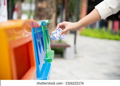 Closeup Portrait Woman Hand Throwing Crumpled Paper In Recycling Bin.