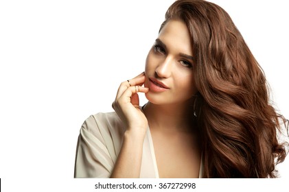 Close-up Portrait Of A Woman With Long Thick Dark Hair On A White Background