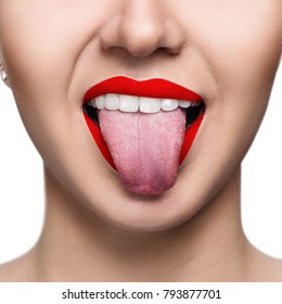 Close-up Portrait Of Woman With Red Lips Shows Tongue.