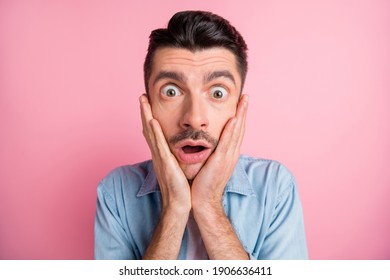 Close-up portrait of worried nervous frustrated guy incredible news reaction isolated over pink pastel color background