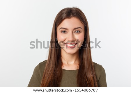 Photo of Close-up portrait of yong woman casual portrait in positive view, big smile, beautiful model posing in studio over white background. Caucasian Asian portrait woman.