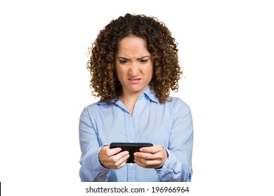 Closeup Portrait Young Angry Woman Unhappy, Annoyed By Something, Someone On Her Cell Phone While Texting, Receiving Bad Sms, Text Message, Isolated White Background. Human Face Expressions, Reaction