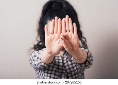 Closeup Portrait Of Young Annoyed Woman With Bad Attitude, Giving Talk To Hand Gesture With Palm Outward. Negative Human Emotion, Facial Expression Feeling, Body Language