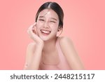 Close-up portrait of young Asian beautiful woman with K-beauty make up style and healthy and perfect skin isolated on pink background for skincare commercial product advertising.