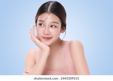 Close-up portrait of young Asian beautiful woman with K-beauty make up style and healthy and perfect skin isolated on light blue background for skincare commercial product advertising. - Powered by Shutterstock