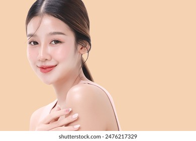 Close-up portrait of young Asian beautiful woman with K-beauty make up style and healthy and perfect skin isolated on beige background for skincare commercial product advertising. - Powered by Shutterstock