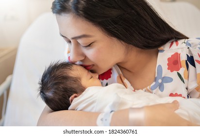 Closeup Portrait Of Young Asian Indian Hispanic Mother Day Holding Newborn Baby With Copy Space. Healthcare And Medical Daycare Nursery Love Lifestyle Together Single Mom Mother’s Day Holiday Concept