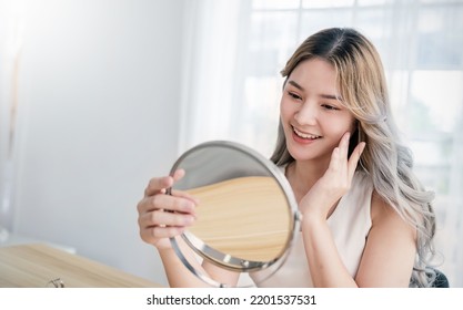 Closeup Portrait Young Beautiful Asian Girl With Mirror Makeup Routine With Copy Space. Beauty Influencer Woman Perfect Glow Touch Skin Dress Up. Healthcare Woman Lifestyle Cosmetic Blogger Concept