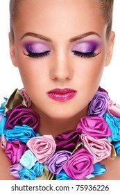 Close-up portrait of young beautiful blond girl with closed eyes and stylish violet make-up