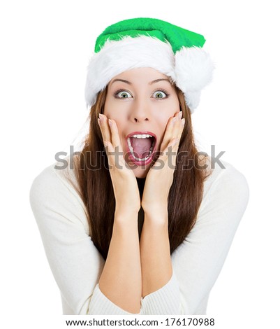 Closeup portrait of young beautiful excited, happy woman wearing green hat, looking shocked, surprised by what she just saw, isolated on white background. Positive human emotions, facial expressions.