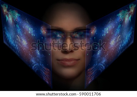 Close-up portrait of young and beautiful woman with the virtual futuristic glasses ( technology concept).Virtual holographic interface and young woman wearing glasses

