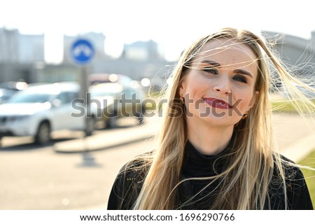 Image, Stock Photo smiling young woman leaning against a wall