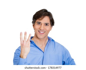 Closeup portrait of young handsome business man giving three fingers sign gesture with hand, isolated on white background. Positive human emotions, facial expressions, feeling, symbols, sign, reaction