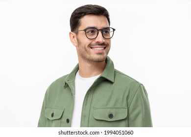 Close-up portrait of young handsome smiling man wearing casual green shirt and glasses, looking away isolated on gray background - Powered by Shutterstock