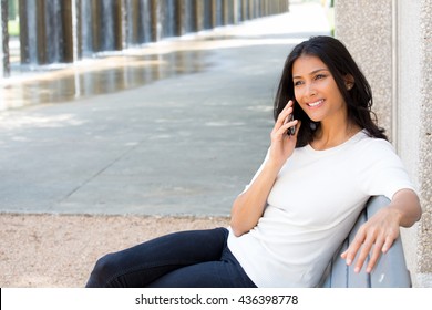 Closeup Portrait, Young, Happy Beautiful Woman In White Shirt Sitting, Speaking On Cell Phone, Sitting On Park Bench, Isolated Outside Outdoors Background. Good News